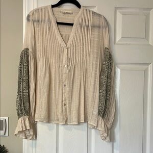 Women's cream blouse purchased from Anthropologie . 100% cotton